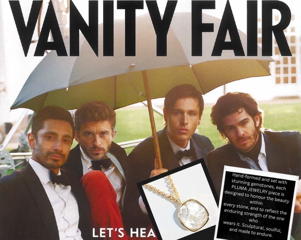 Vanity Fair magazine cover with four men under an umbrella and a necklace advertisement.